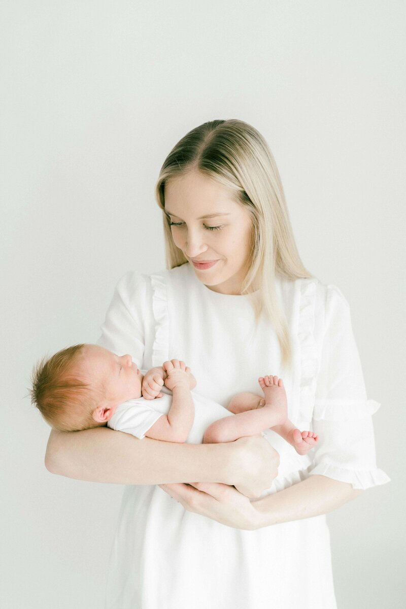 Mother cradling her newborn baby