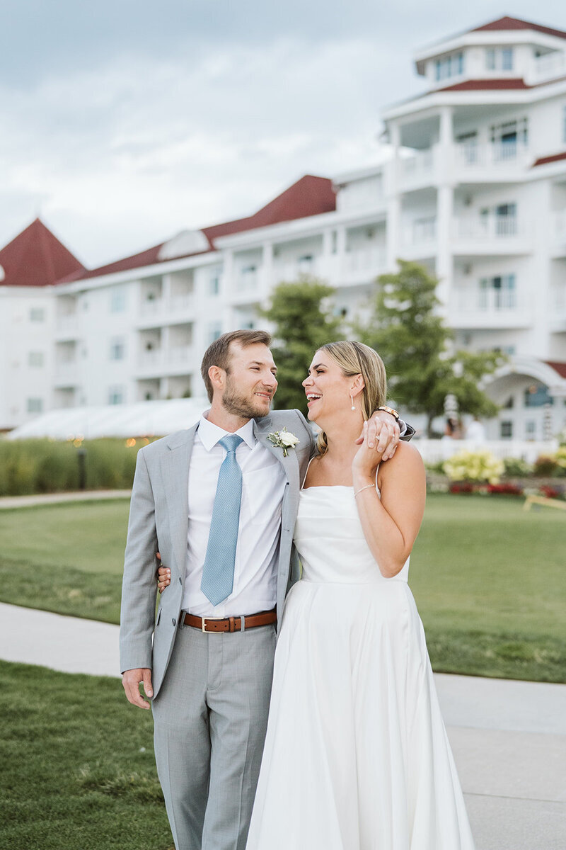 Bride and groom smiling during their Michigan wedding packages.