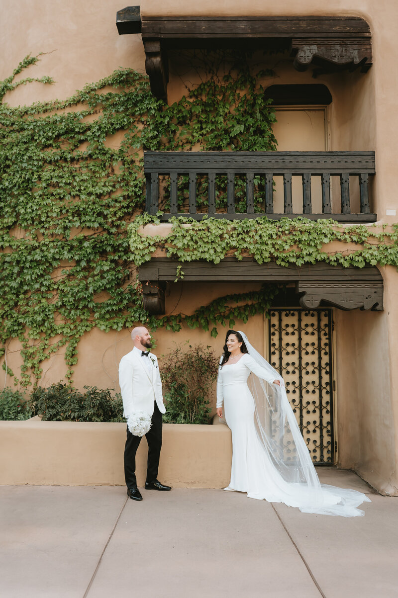 Bride and Groom kissing with cathedral in background