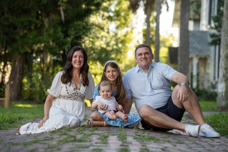 family-pose-on-cobble-stone-street-in-downtown-st-augustine