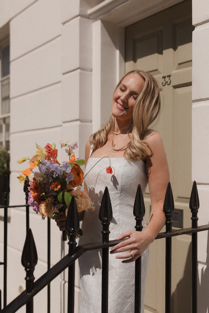 Wedding photographer captures couple taking a stroll hand in hand at their french chateau wedding.