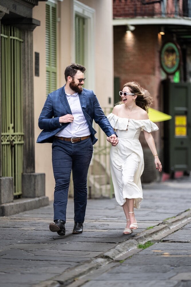 Couple walking in Pirate's Alley