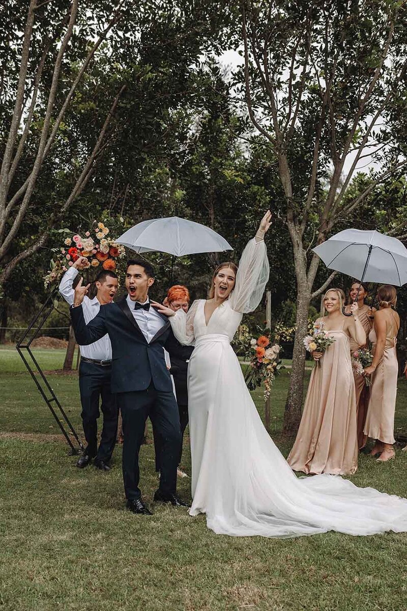 G&J-Bride and groom cheering at the ceremony