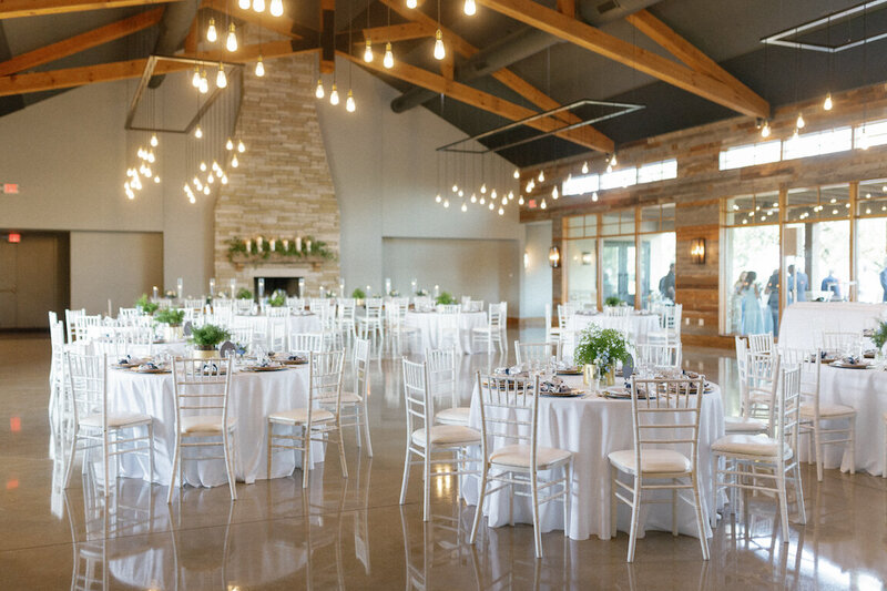Reception decor in Canyonwood Ridge hall with romantic lighting and Hill Country details