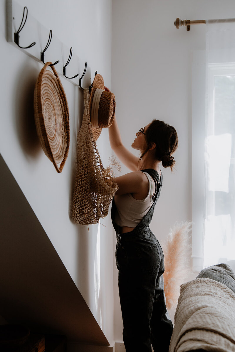 a woman decorating her studio in new paltz, new york