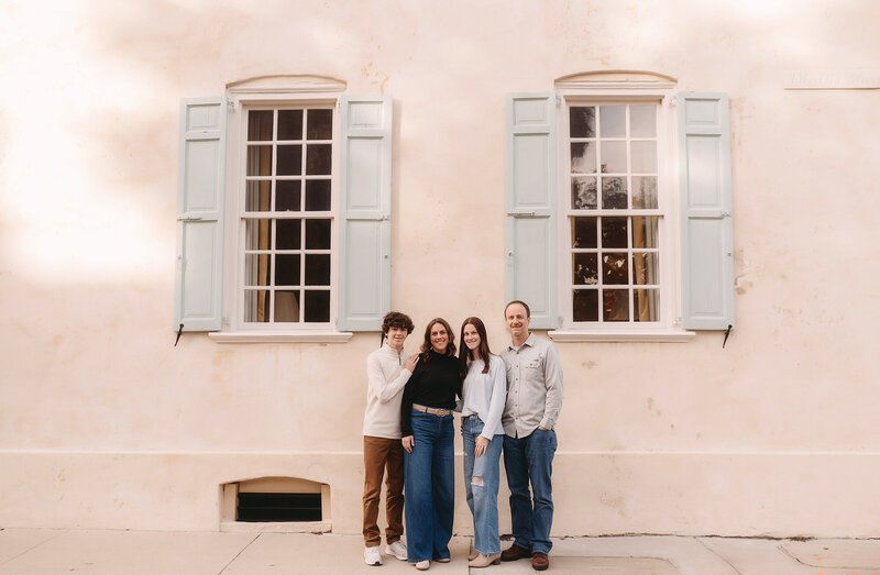 Family poses for Family Portraits in downtown Charleston.