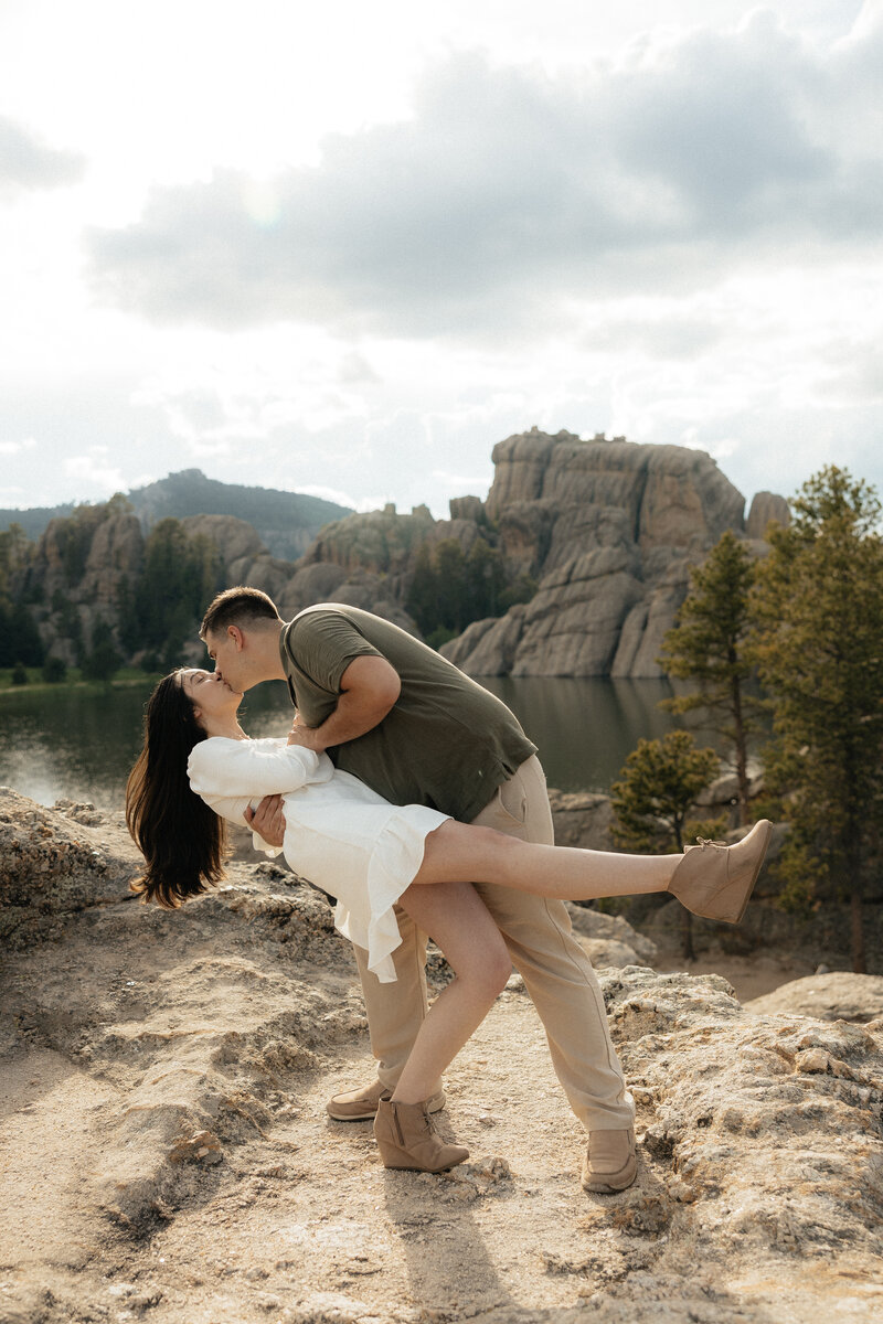 A man twirling his fiance.