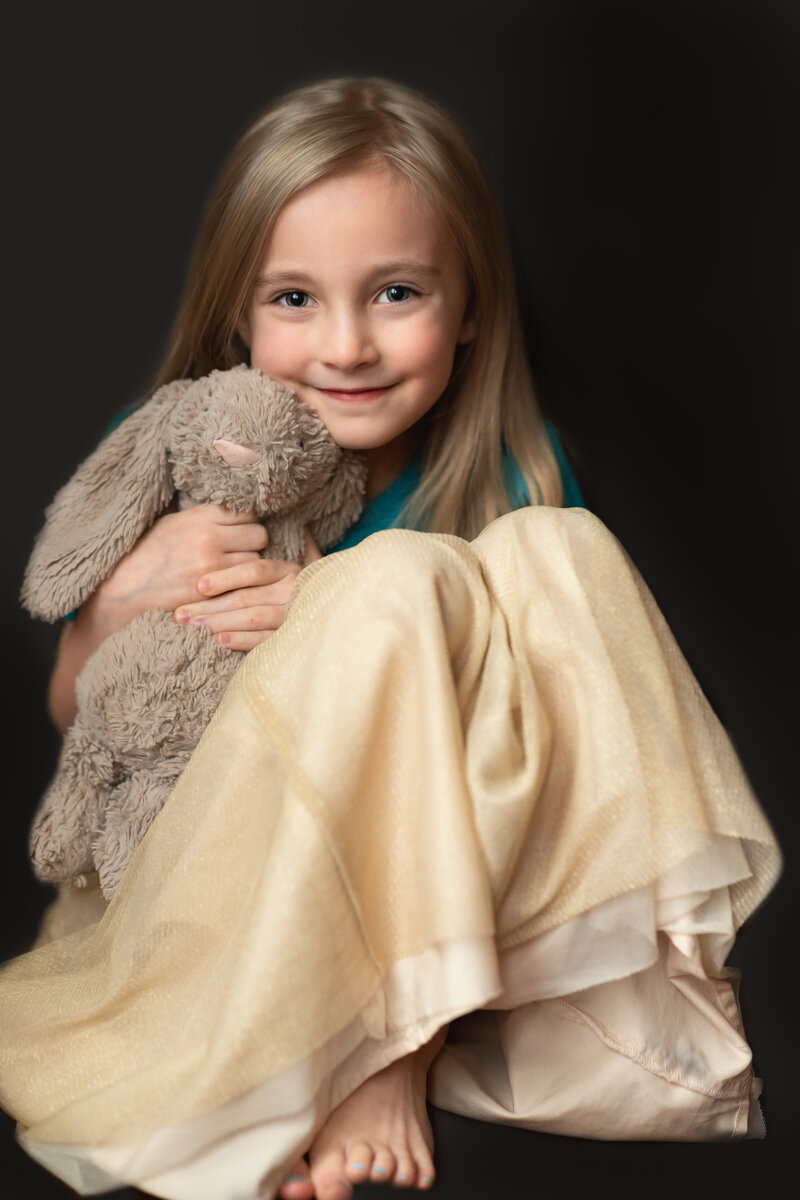 Fine-art photo of 6 year old with her stuffed bunny Mimzy.