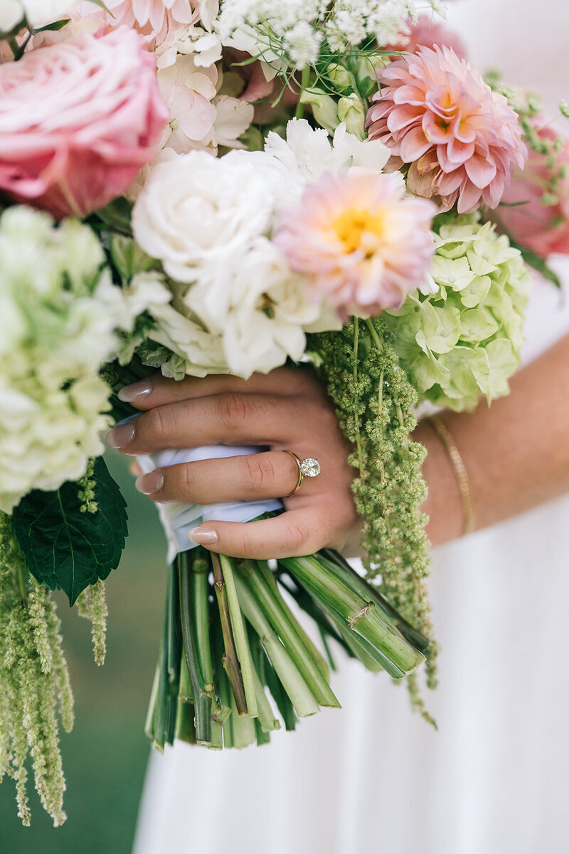 Bride with ring holding pink and green bouquet at upstate SC wedding designed by Abby Grace Florals