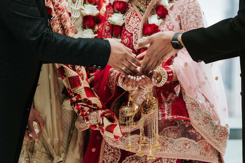 ​Bride and groom celebrating Indian Wedding Kanyadan ​in Philadelphia.