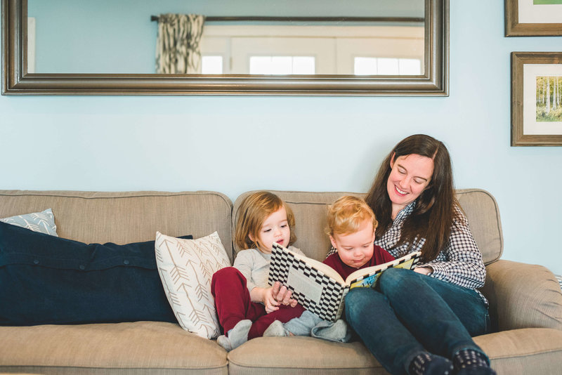 mom reading to kids on couch