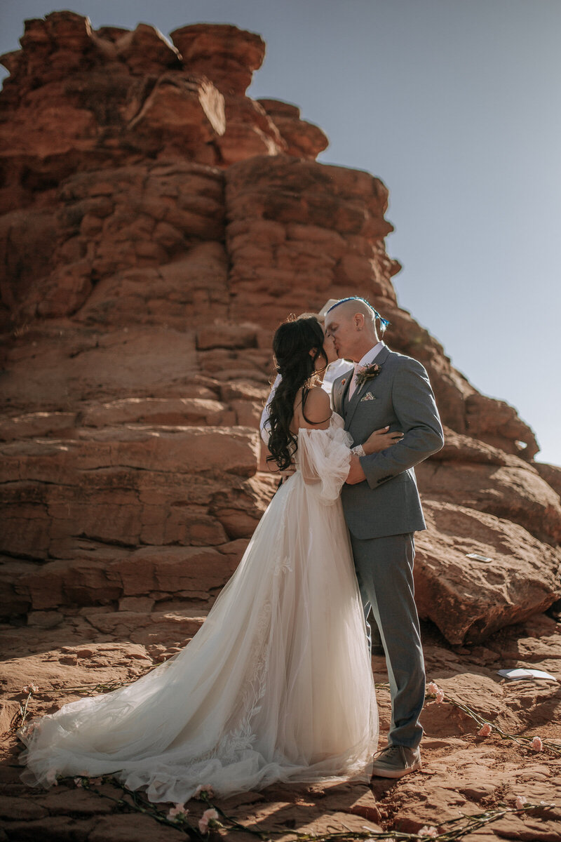 bride and groom first kiss on their elopement