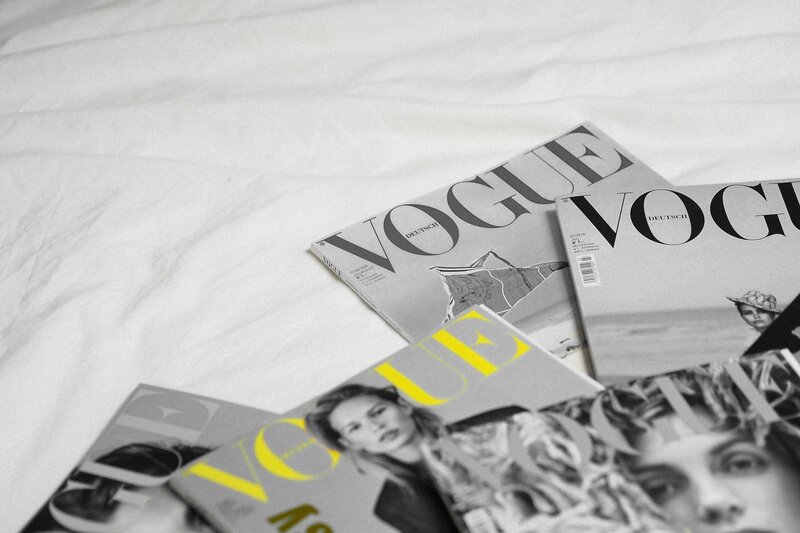 Flash photo of Vogue magazines on a white background
