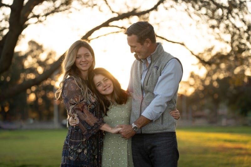 Family-enjoying-a-sunset-together