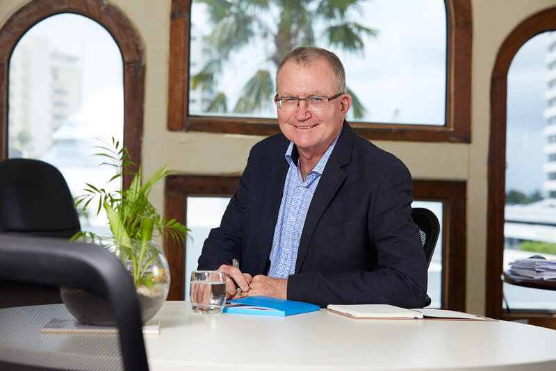 MKM mediation owner sitting at desk