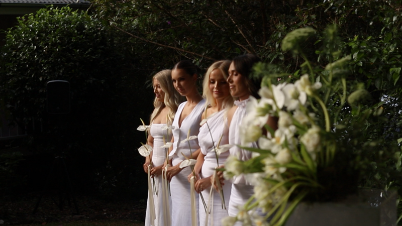 Bridesmaids stand at the front of the ceremony a Montville Estate