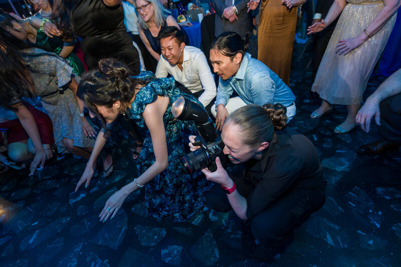 Jen getting down on the dance floor with guests at Adventure Aquarium at the reception