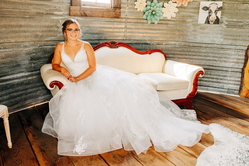 Portrait of bride on antique sofa at Cattle Springs in Arlee, MT