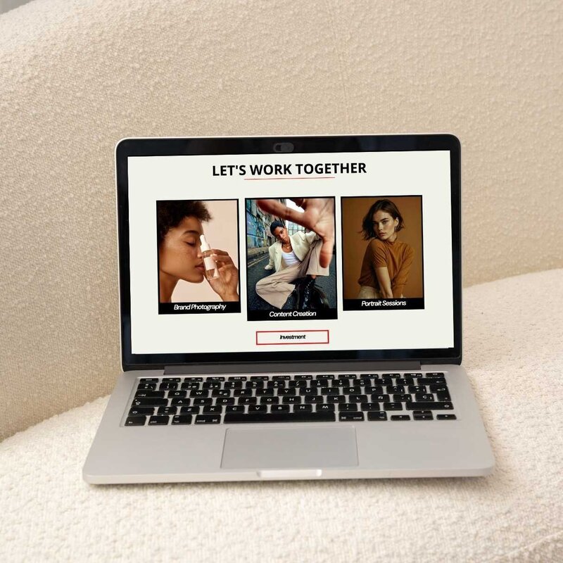 laptop opened on a couch displaying a service section of a website