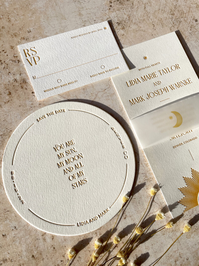 sun and star inspired wedding invitations in golden yellow