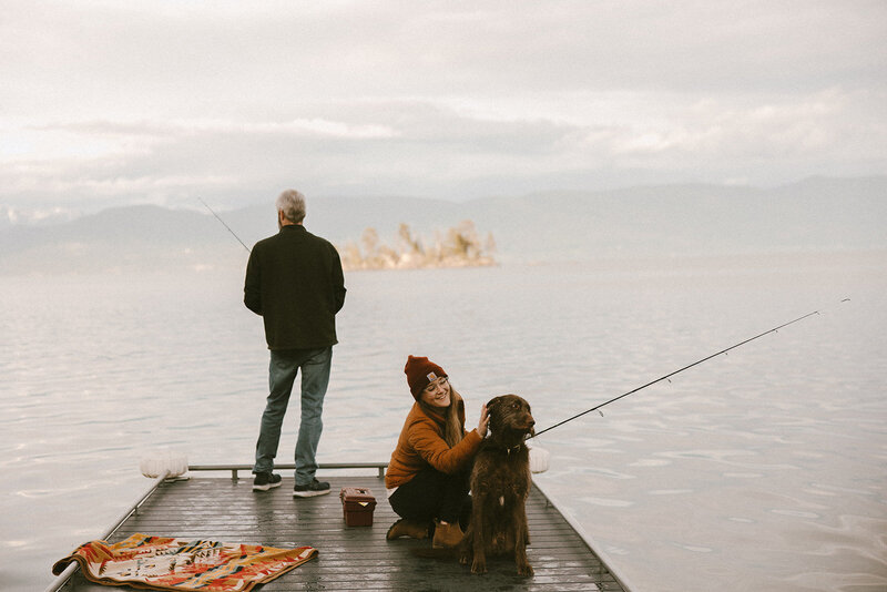 couple fishing with dog