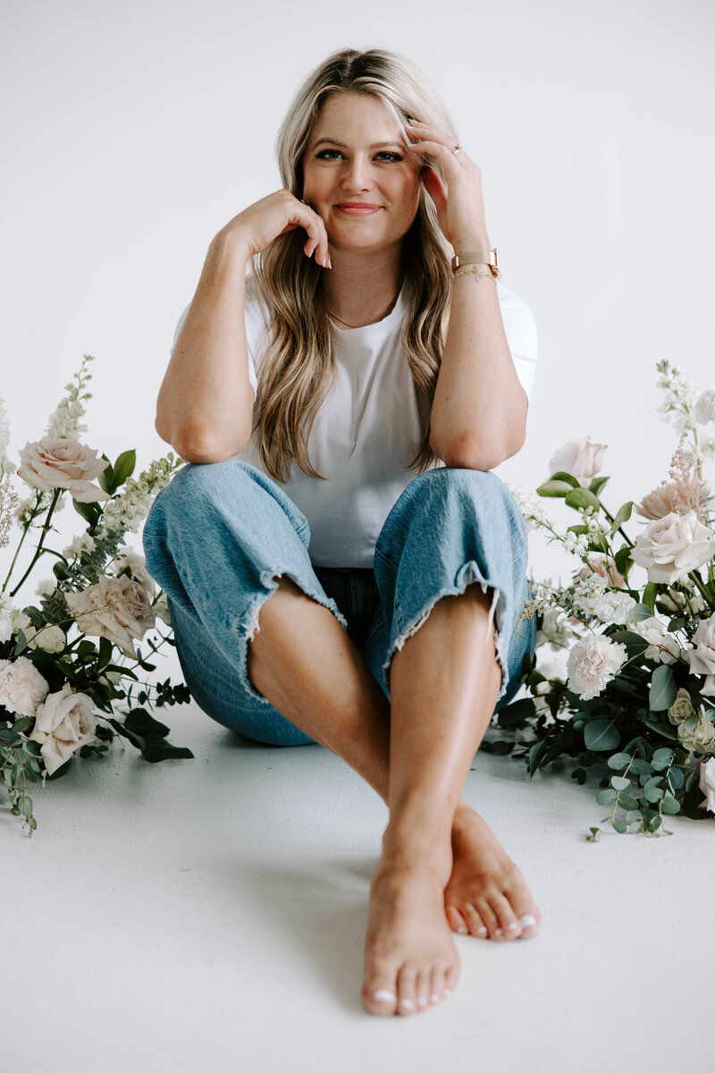 Rachel smiling softly in natural light with a relaxed, confident presence