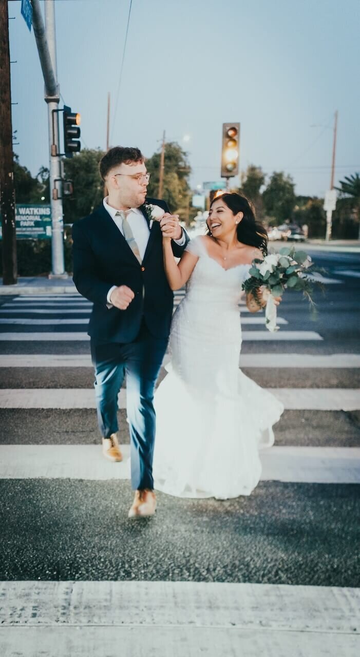 Just married couple enjoying their first moments together in Los Angeles streets.