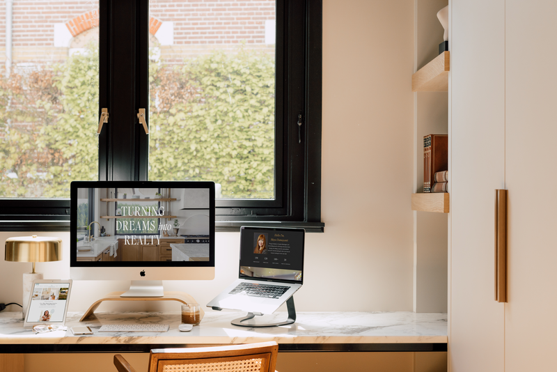 Modern workspace with dual monitors for a real estate web design and SEO company