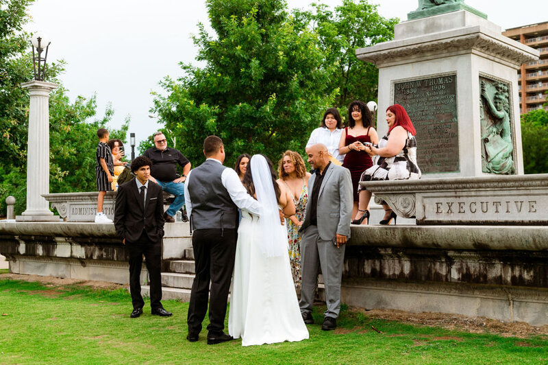 Elopement guests congratulating the newlyweds moments after their vows.
