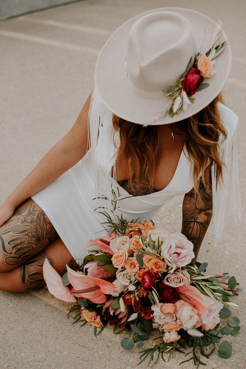 Tattooed bride in hat