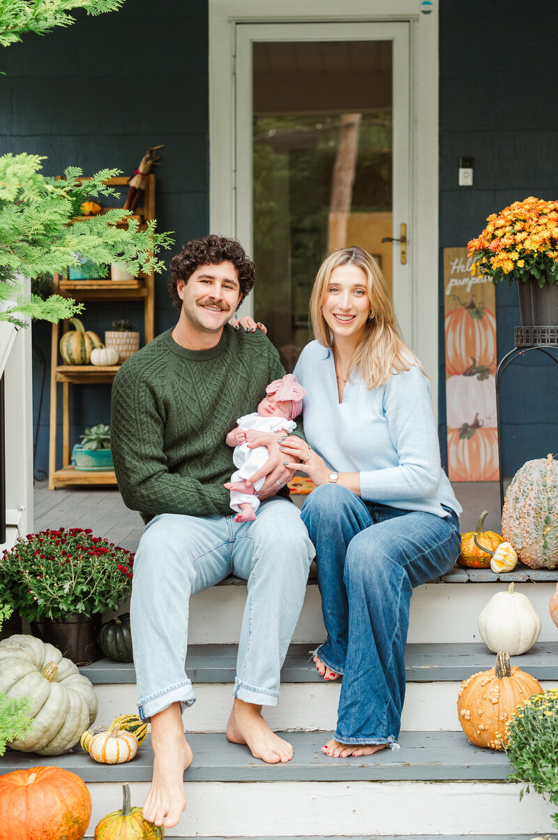 family posing on porch by york pa photographer