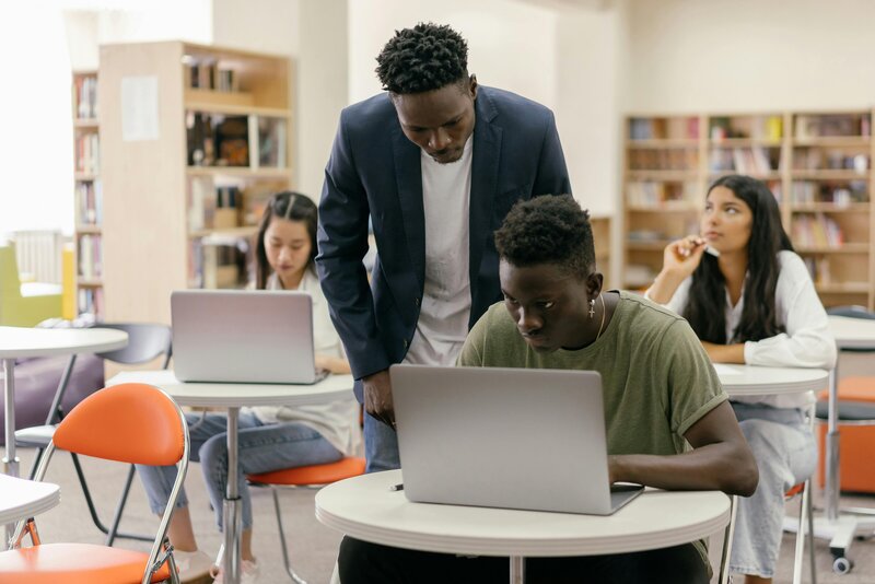 african american male student and male teacher