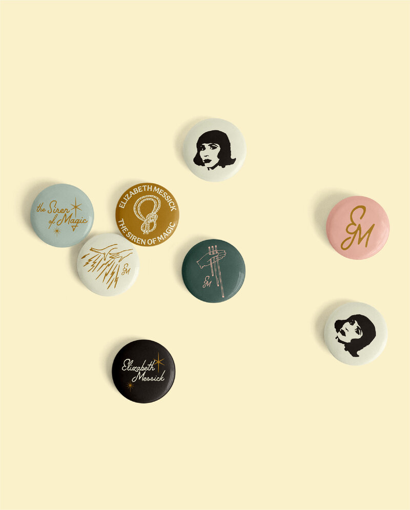 merchandise mockup small circle pins for elizabeth messick the siren of magic