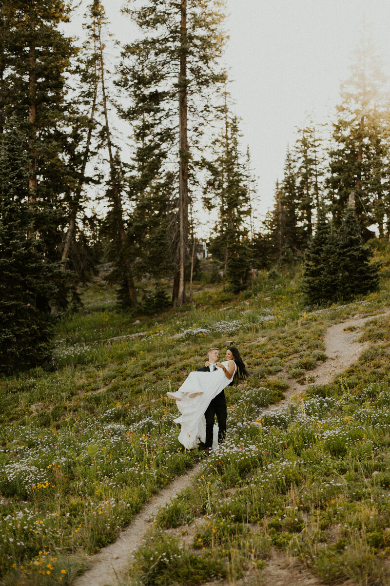 Couple Swinging around and laughing during their Crested Butte elopement