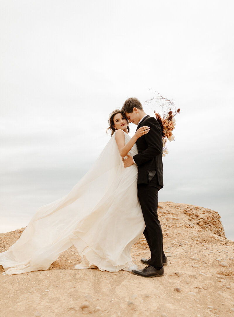 bride and groom at cliffside wedding at Sunset Cliffs