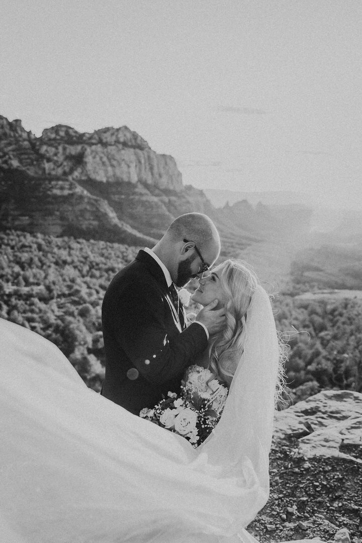 couple staring deeply into each others eyes in Sedona Arizona
