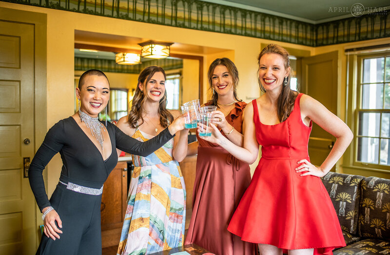 Guest Cheers with Drinks Inside the Aspen Room at Boettcher Mansion on Lookout Mountain