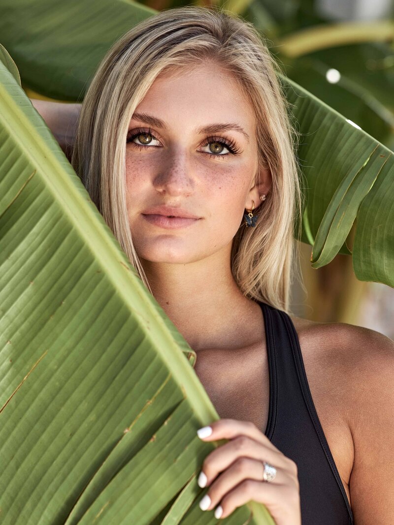 senior model in palm leaves