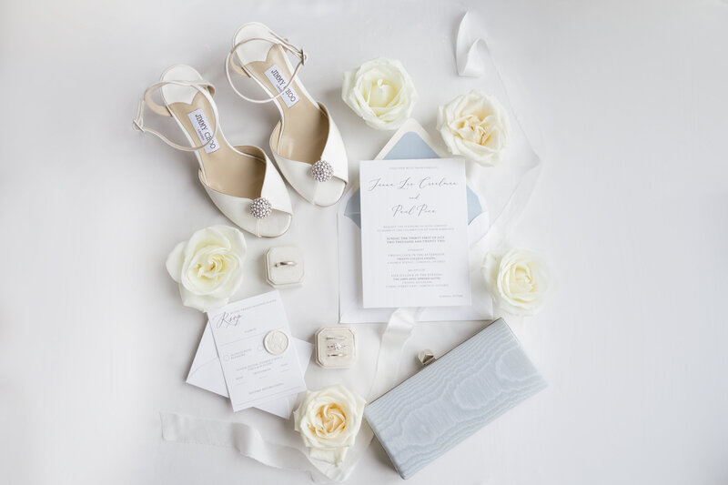 jimmy choo bridal shoes and wedding invitation flat lay