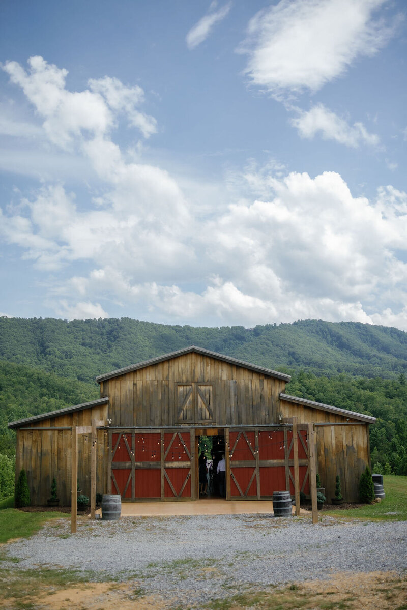 Mountain Mist Farms barn with the Smokies behind the barn