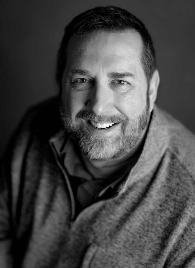 A studio portrait of a smiling Ohio photographer.
