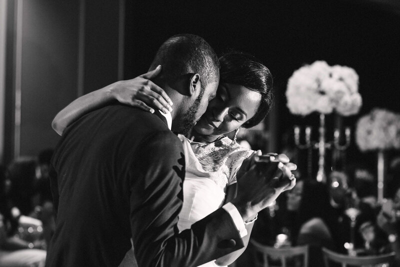 Close-up portrait of a bride and groom sharing an emotional and romantic moment during their first dance.