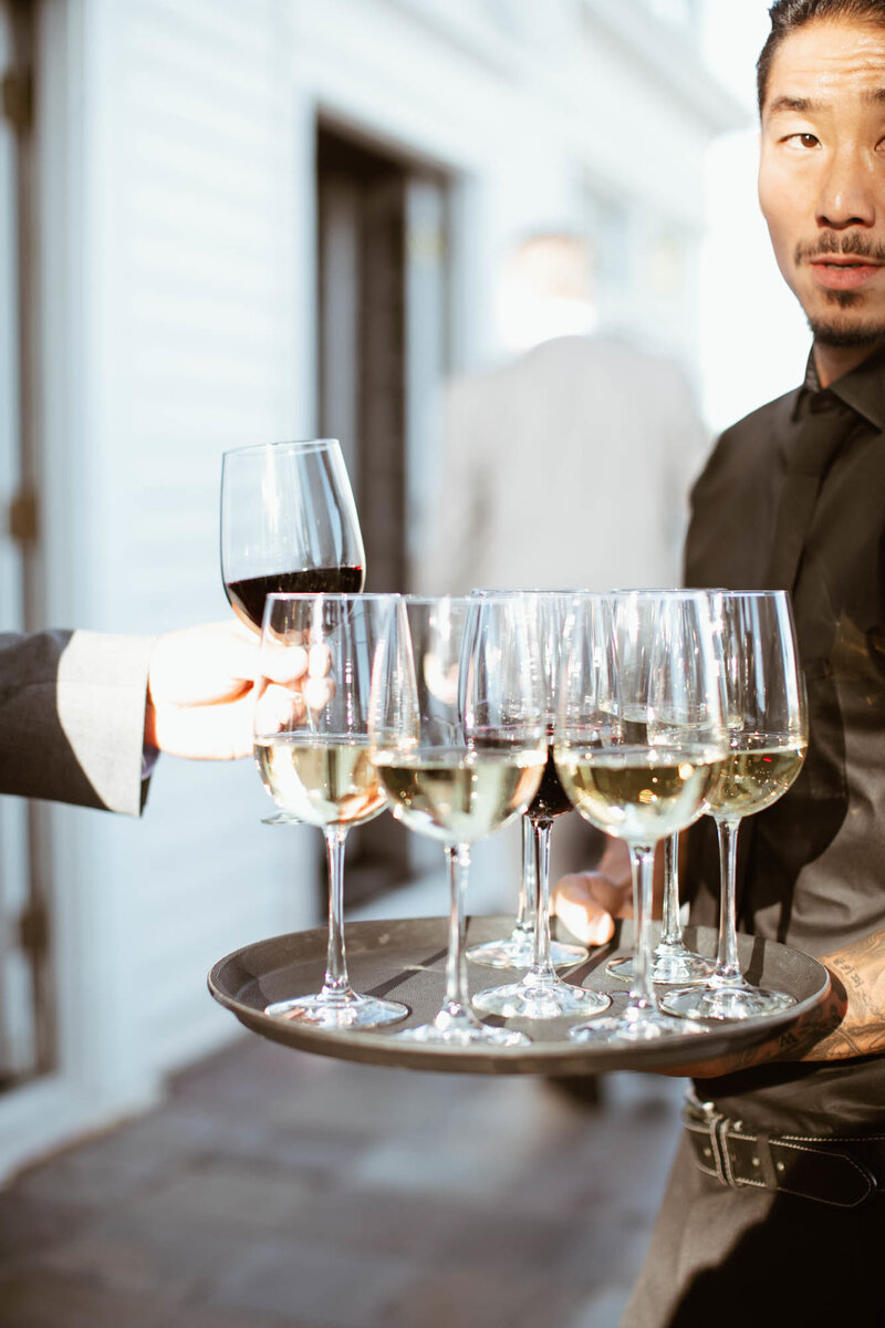 bartender serves wine