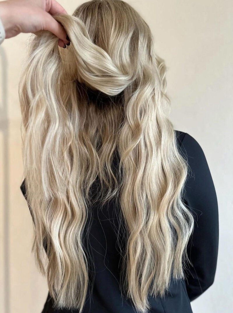 Make your dream hair a reality. Our custom hair extensions create volume, length or both to your natural hair after appointment at Anthology Salon near Appleton Wisconsin