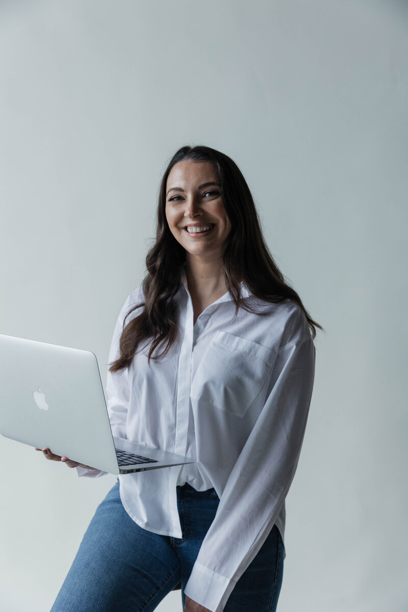 Therapist holding her computer