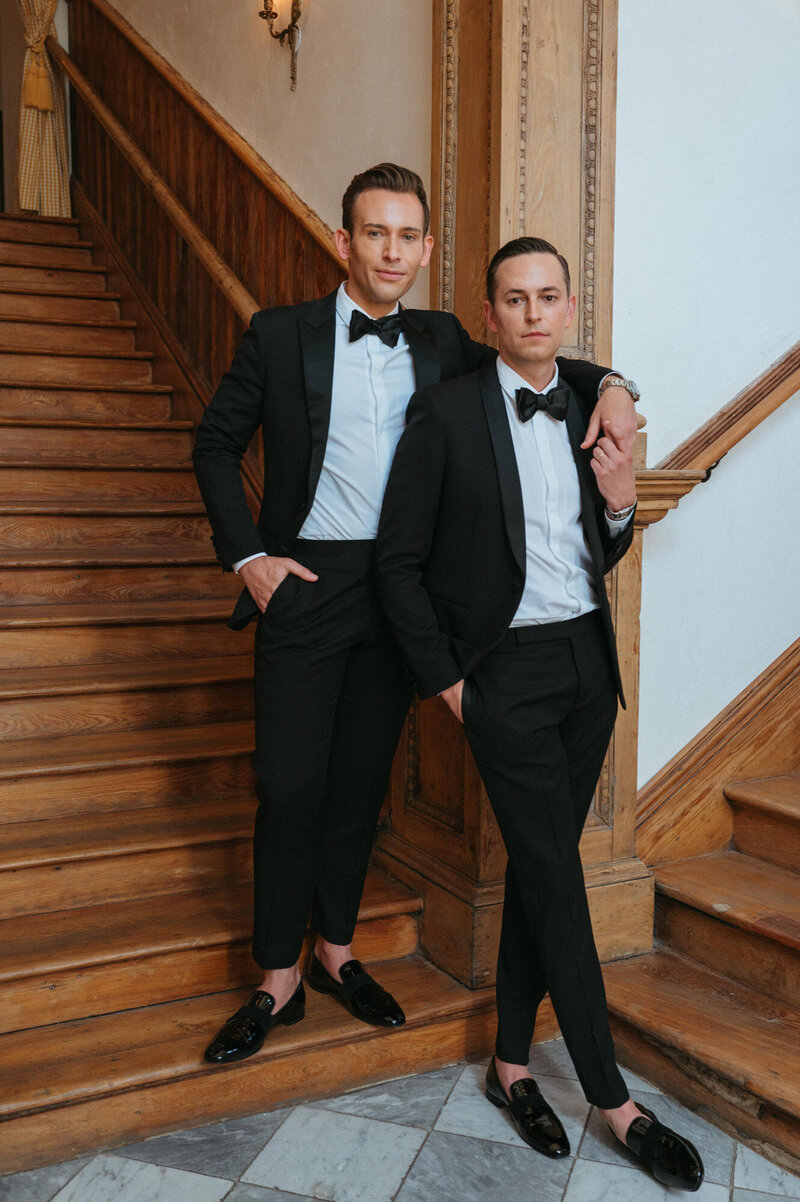 Will and Paul standing at staircases