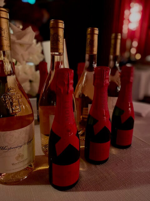 small and large mote bottles on table 