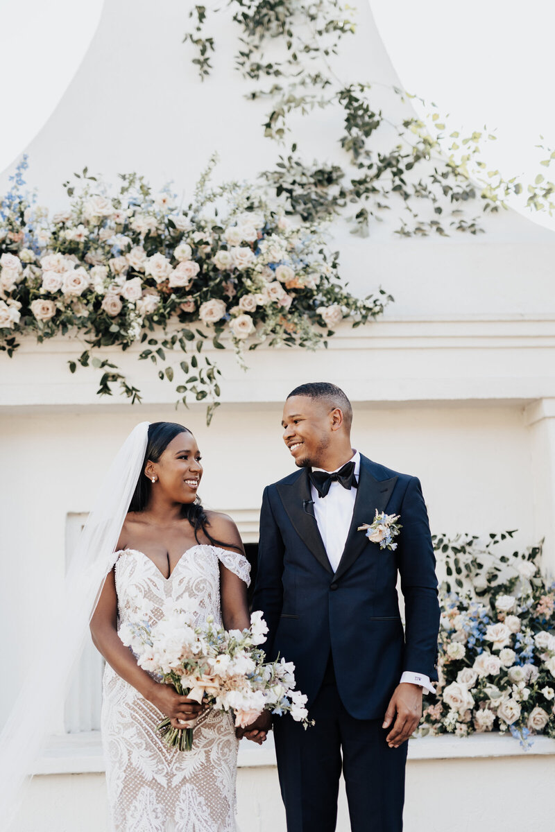 elegant bride and groom with floral design