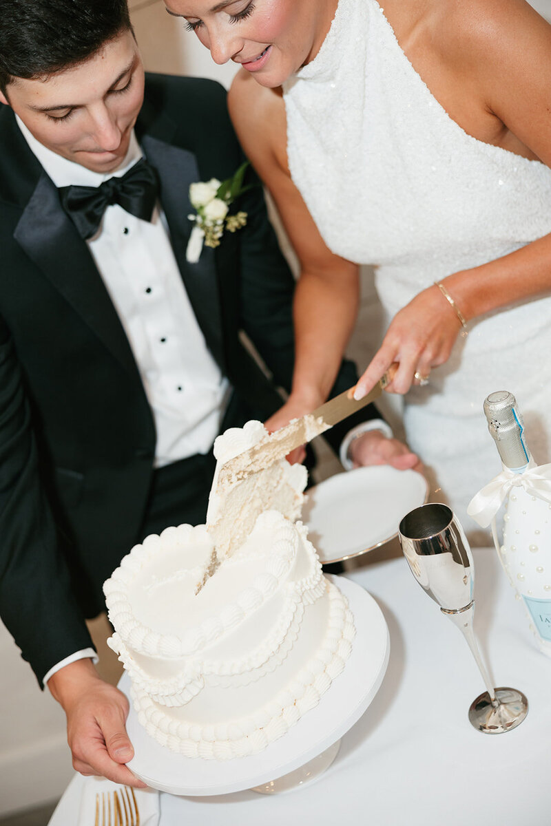 Bride and groom cutting cake at Nashville wedding reception