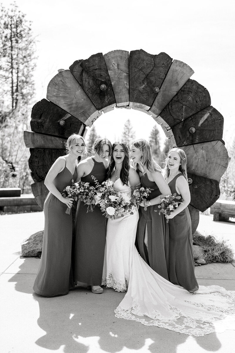 Tiffany Longeway Photography captures the exuberant energy of a bridal party at the stunning Calistoga Ranch in Napa Valley. The striking wood arch and natural surroundings create a perfect backdrop for this candid moment, reflecting the joy and beauty of a luxury wedding celebration in one of California’s premier wine country venues.